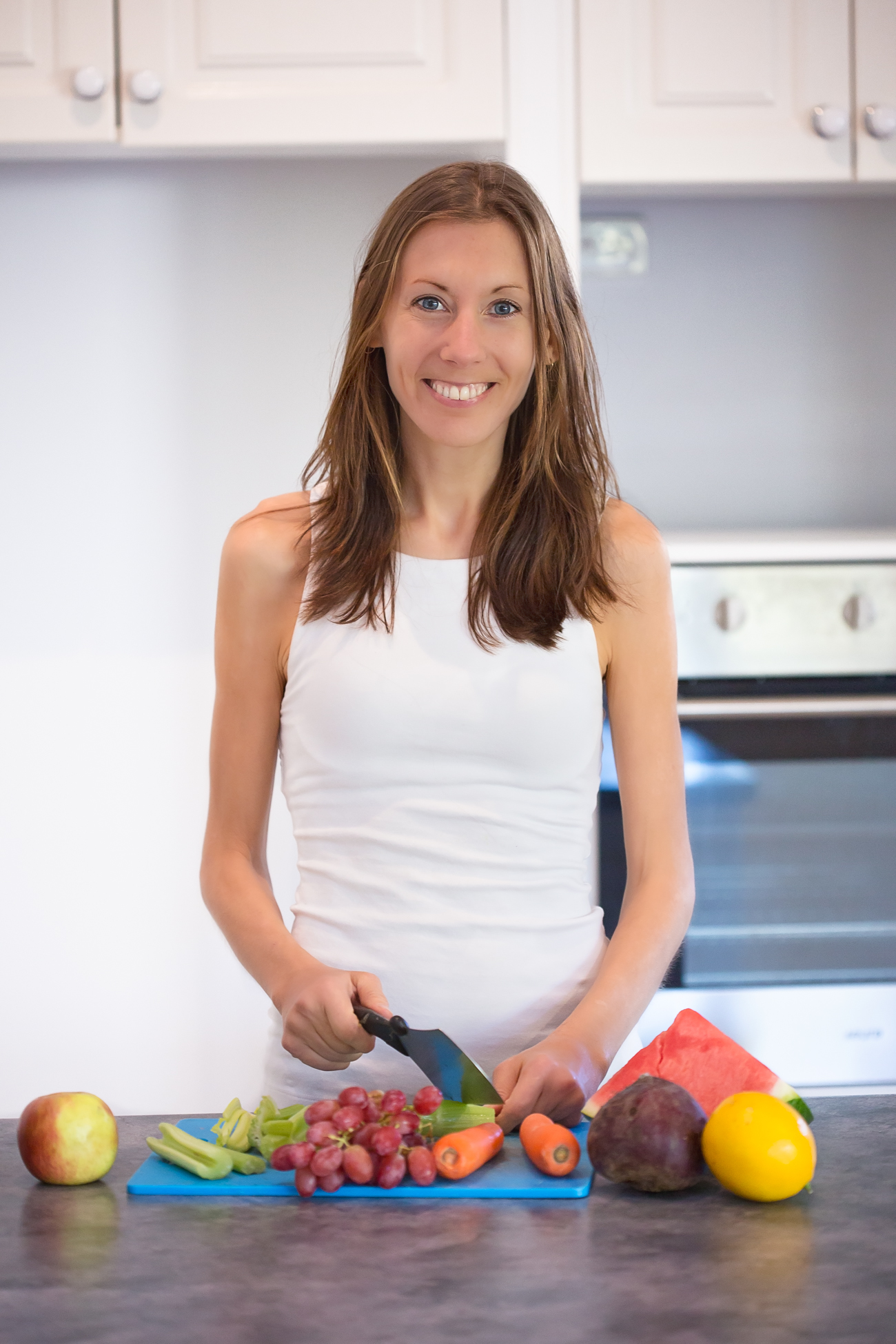 Nadia K chopping vegetables in kitchen