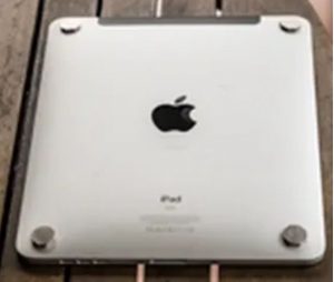 Tesla's Laptop tags stuck on Ipad