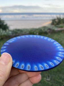Close up of Tesla's Large Spiritual Plate near ocean