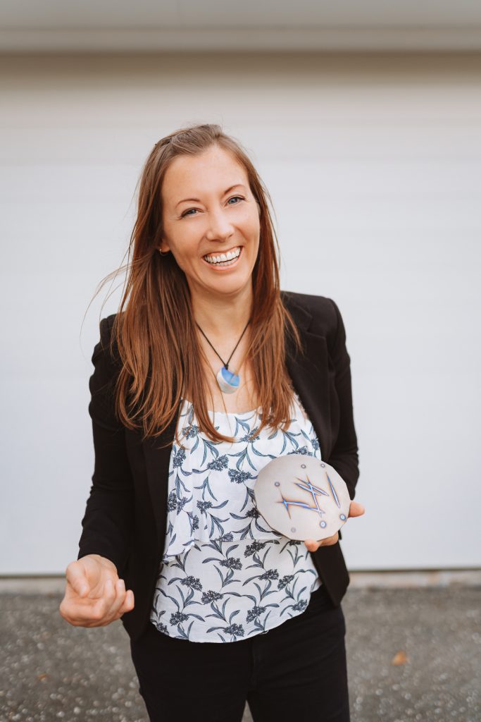 Nadia holding Tesla's 5G Farm Plate